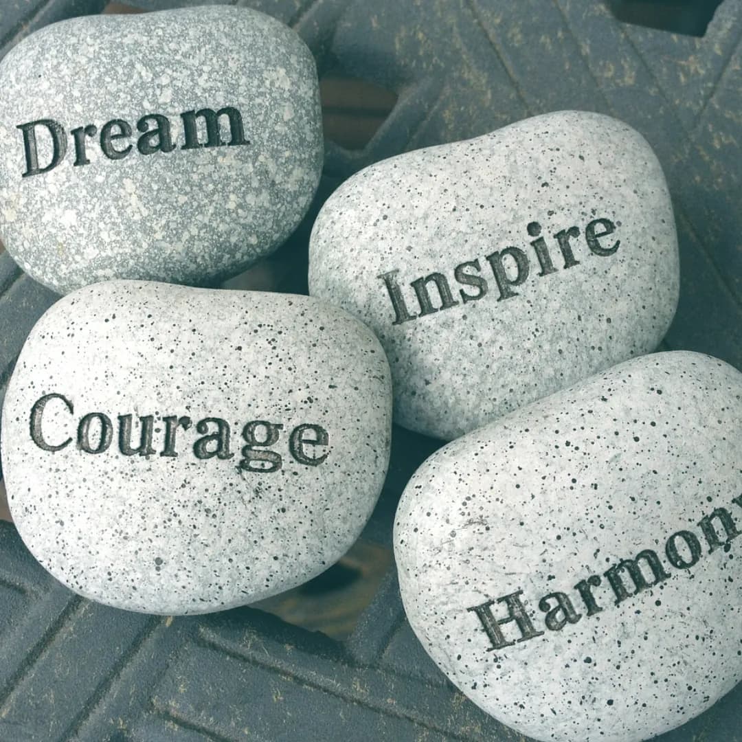 Stones engraved with Dream, Inspire, Courage and Harmony